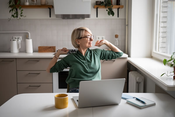 woman working and stretching
